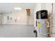 Clean garage with epoxy floors and a modern water heater at 1127 Fiesta Key Cir, Lady Lake, FL 32159
