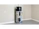New water heater in a clean, modern garage at 1127 Fiesta Key Cir, Lady Lake, FL 32159
