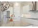 Bright, modern kitchen with granite counters, stainless steel appliances, and pendant lighting at 1127 Fiesta Key Cir, Lady Lake, FL 32159
