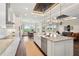 Spacious kitchen with an open layout, large island, and view of the outdoor dining area at 1127 Fiesta Key Cir, Lady Lake, FL 32159