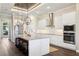 Bright kitchen features a large island, stainless appliances, and a modern wood paneled ceiling at 1127 Fiesta Key Cir, Lady Lake, FL 32159