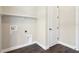 Simple laundry room with upper shelf and modern washer/dryer hookups at 1127 Fiesta Key Cir, Lady Lake, FL 32159