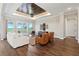 Bright living room featuring modern furniture, hardwood floors, and a decorative ceiling fan at 1127 Fiesta Key Cir, Lady Lake, FL 32159