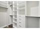 Spacious walk-in closet features custom shelving and drawers for optimal organization at 1127 Fiesta Key Cir, Lady Lake, FL 32159