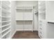 Spacious walk-in closet features custom shelving and drawers for optimal organization at 1127 Fiesta Key Cir, Lady Lake, FL 32159