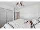 Bedroom featuring a ceiling fan and closet with sliding doors at 11313 Little Nellie Dr, Clermont, FL 34711
