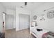 Well-lit bedroom with playful decor, closet, and comfortable bed at 11313 Little Nellie Dr, Clermont, FL 34711