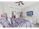 Spacious bedroom featuring modern furniture, a large dresser, and wood floors at 11313 Little Nellie Dr, Clermont, FL 34711