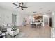 Open-concept living space connecting the kitchen, dining area, and living room, ideal for entertaining guests at 11313 Little Nellie Dr, Clermont, FL 34711