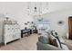 Stylish living area features a unique light fixture, a piano, and comfortable seating for a relaxing atmosphere at 11313 Little Nellie Dr, Clermont, FL 34711