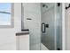 Modern shower with black fixtures, geometric tile, and a glass enclosure at 11313 Little Nellie Dr, Clermont, FL 34711