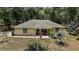 Charming single-story home with a cozy front porch and well-maintained landscaping at 11495 Se 71St Terrace Rd, Morriston, FL 32668