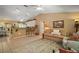 Open-concept living area with bar seating, tile floors, and neutral tones for a bright feel at 11495 Se 71St Terrace Rd, Morriston, FL 32668