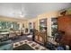 Cozy sunroom featuring plenty of natural light and comfortable seating at 11495 Se 71St Terrace Rd, Morriston, FL 32668