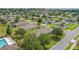 Bird's eye view of home in a neighborhood with mature trees and manicured lawns at 11601 Thacker Dr, Clermont, FL 34711