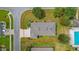 An aerial view of a perfectly manicured lawn surrounding a lovely house at 11601 Thacker Dr, Clermont, FL 34711