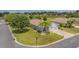 Inviting curb appeal highlighted by a lush lawn and mature landscaping, showcasing a well-maintained property at 11601 Thacker Dr, Clermont, FL 34711