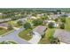Aerial view showcasing a home within a community featuring lush landscaping at 11601 Thacker Dr, Clermont, FL 34711