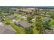 Aerial view showcasing a property within a residential neighborhood and nearby construction site at 11601 Thacker Dr, Clermont, FL 34711