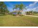 Charming single-story home with well-manicured landscaping and a spacious driveway at 11601 Thacker Dr, Clermont, FL 34711