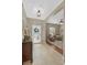Inviting foyer features a decorative front door, tiled floor, and views into the adjacent seating area at 11601 Thacker Dr, Clermont, FL 34711