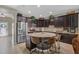 Well-equipped kitchen with stainless steel appliances, a central island with seating, and plenty of cabinet space at 11601 Thacker Dr, Clermont, FL 34711