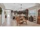 Bright kitchen featuring a center island, wooden chairs, and easy access to the front entrance at 11601 Thacker Dr, Clermont, FL 34711
