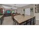 Spacious kitchen featuring a large island, tile floors, and seamless access to the living and dining areas at 11601 Thacker Dr, Clermont, FL 34711
