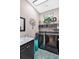 Bright laundry room with modern washer and dryer, sink, and decorative accents at 11601 Thacker Dr, Clermont, FL 34711