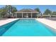 Community pool with ample seating and a covered pavilion for residents to enjoy at 11601 Thacker Dr, Clermont, FL 34711
