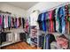Functional walk-in closet with ample storage and organization for clothing, shoes, and accessories at 11601 Thacker Dr, Clermont, FL 34711