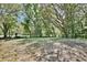 Expansive backyard shaded by mature trees, perfect for outdoor enjoyment at 1228 Padgett Cir, Lady Lake, FL 32159