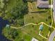 Overhead view of backyard, green space, and lakeside community walking trails at 124 Juno Dr, Groveland, FL 34736