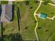 An aerial view of the property backing onto the park, with scenic walking trails at 124 Juno Dr, Groveland, FL 34736