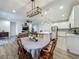 Open-concept layout with a dining area, living room, and well-equipped kitchen at 124 Juno Dr, Groveland, FL 34736