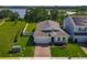 New construction single Gathering home with a brick driveway and beautifully manicured lawn at 124 Juno Dr, Groveland, FL 34736
