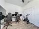 Home office features lots of light, gaming chairs, and work out equipment for a balanced lifestyle at 124 Juno Dr, Groveland, FL 34736