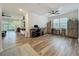 Open-concept living space with hardwood floors and plenty of natural light at 124 Juno Dr, Groveland, FL 34736