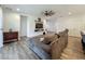 Comfortable living room with hardwood floors and a wall-mounted television at 124 Juno Dr, Groveland, FL 34736