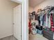 A walk-in closet offers ample space for organization, awaiting your personal touch for efficient storage at 124 Juno Dr, Groveland, FL 34736