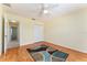 View of a bedroom featuring wood-look flooring, a ceiling fan, and closet with sliding doors at 1282 Fort Lawn Loop, The Villages, FL 32162