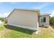 Exterior of a well-maintained home with neutral siding, showcasing its clean lines and simple design at 1282 Fort Lawn Loop, The Villages, FL 32162