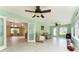 Sunroom featuring tile floors, glass french doors, plenty of windows and ceiling fans at 1282 Fort Lawn Loop, The Villages, FL 32162