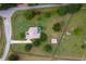 Sprawling estate featuring a pool, outbuildings, and fenced pasture at 12913 County Road 104B, Oxford, FL 34484