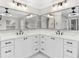 Stylish bathroom with double vanities, quartz countertop, and sleek black hardware at 12913 County Road 104B, Oxford, FL 34484