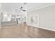 Spacious living area showing open floor plan concept with access to kitchen and backyard at 12913 County Road 104B, Oxford, FL 34484