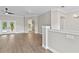 Open living space with hardwood floors, neutral paint, and French doors to the pool at 12913 County Road 104B, Oxford, FL 34484