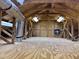 Finished attic with wood beams, plywood flooring, ductwork, fan and lighting at 1339 Orchid Ave, Winter Park, FL 32789