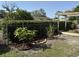 Backyard with a chain link fence, mature trees, and mulched landscape beds at 1339 Orchid Ave, Winter Park, FL 32789