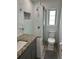 Modern bathroom with a sleek glass shower, granite vanity and new fixtures at 1339 Orchid Ave, Winter Park, FL 32789